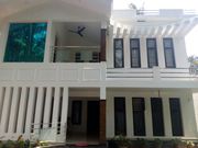 Land for sale including a house and building in front of the bus stop 